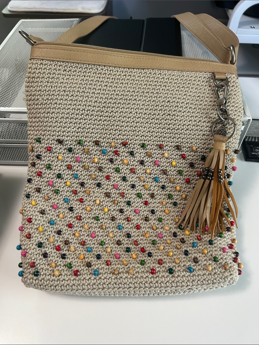 The Sak Beige Woven Crossbody with Multicolor Beads and Tan Tassel